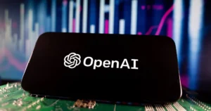 View,Of,Openai,Logo,On,Smartphone,Screen,With,Financial,Charts.