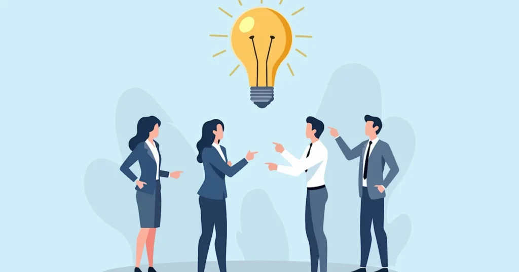 Business,Team,Collaborating,On,Innovative,Ideas,With,A,Glowing,Lightbulb