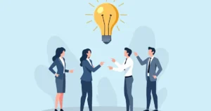 Business,Team,Collaborating,On,Innovative,Ideas,With,A,Glowing,Lightbulb