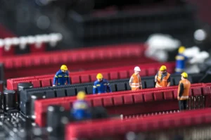 Group,Of,Miniature,Engineers,Fixing,Computer,Circuit,Board.,Macro,Photo